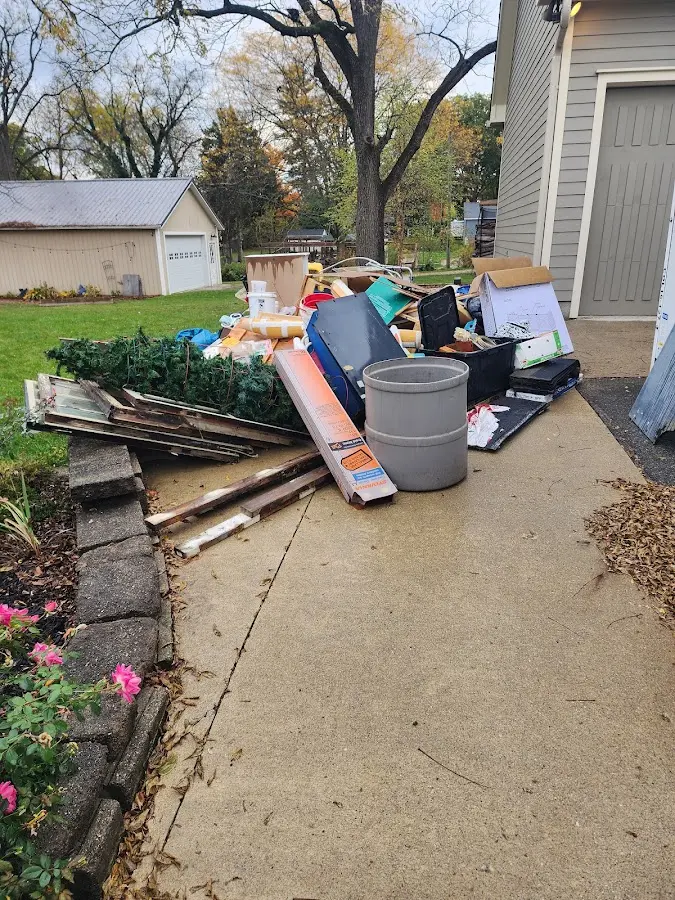 Dumpster being loaded with debris for 3 Yard Dumpster Rental in China Grove